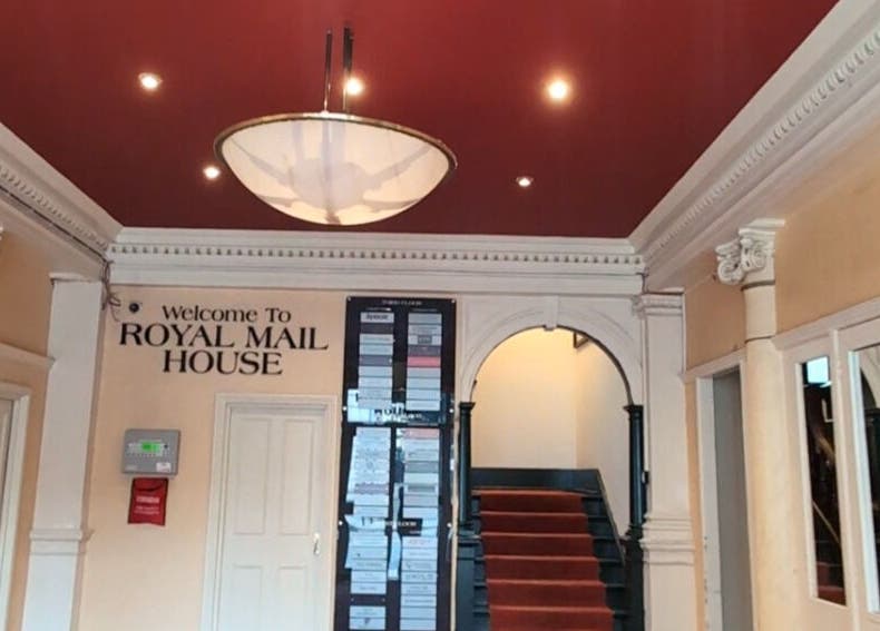 Elegant lobby of Renewal Integrative Rehab in Southampton, England, GB with rich red ceiling and welcome sign.