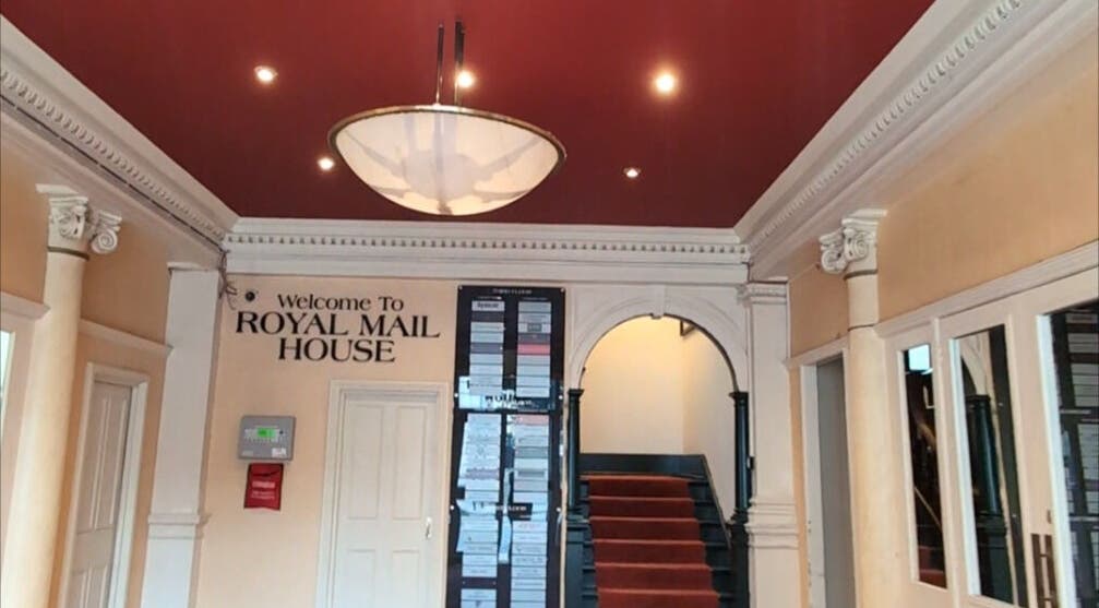 Elegant lobby of Renewal Integrative Rehab in Southampton, England, GB with rich red ceiling and welcome sign.