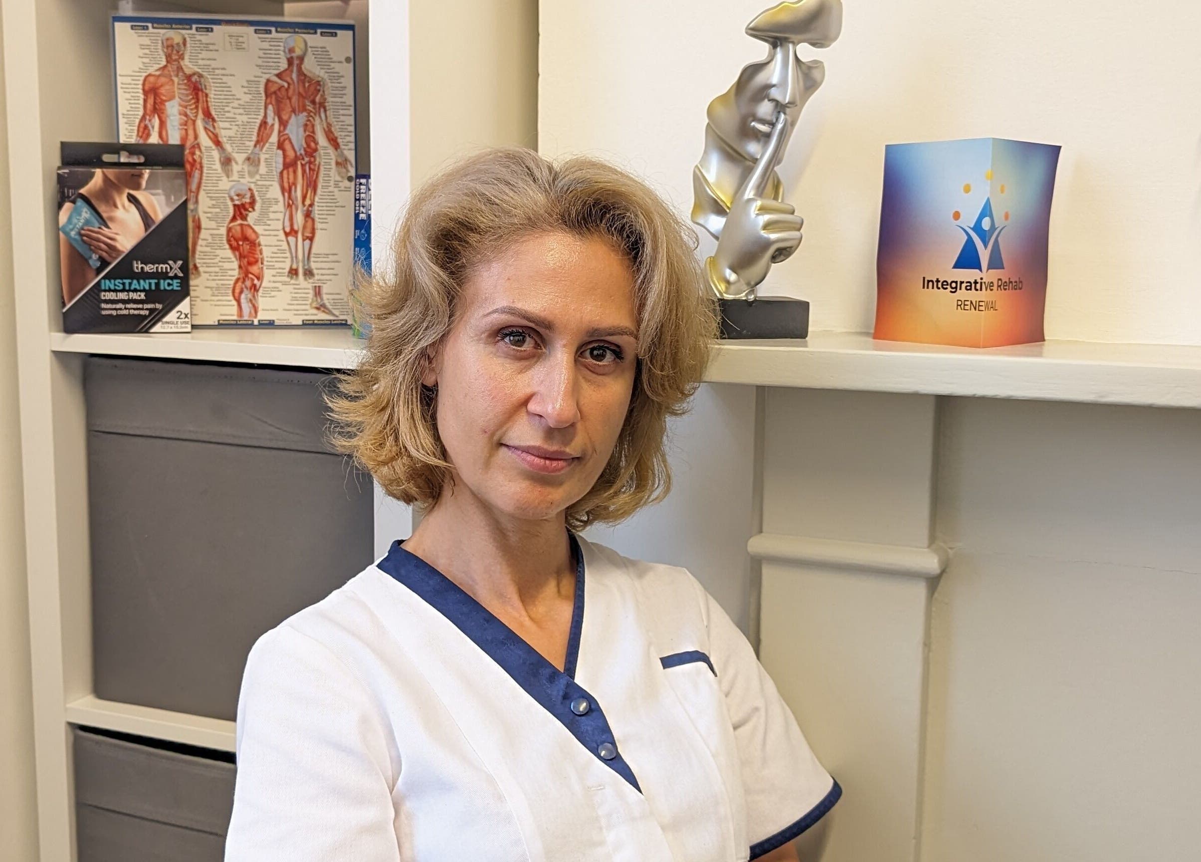 Therapist at RENEWAL INTEGRATIVE REHAB, Southampton, England, GB, in a calm consultation room.