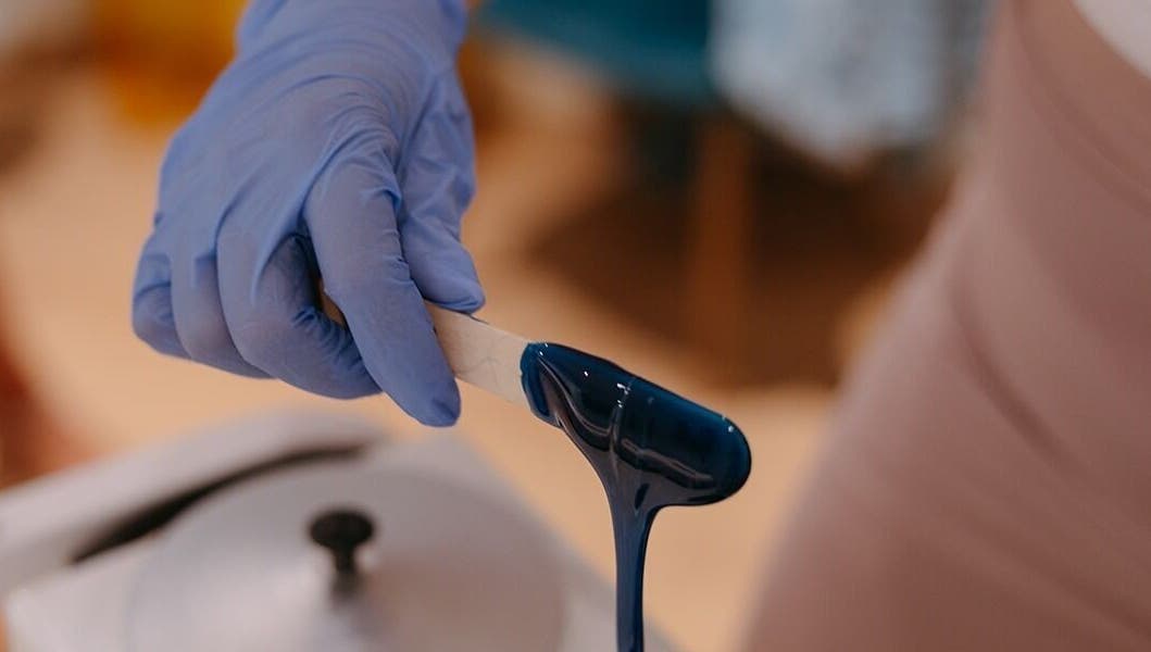 Blue wax application at Dewdrop Lounge, Mission, British Columbia, CA, showcasing professional beauty service.