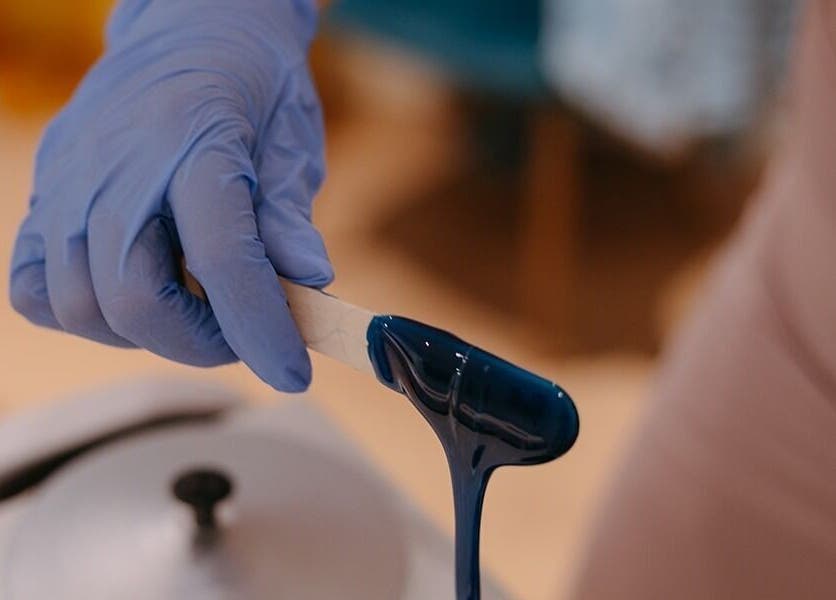 Blue wax application at Dewdrop Lounge, Mission, British Columbia, CA, showcasing professional beauty service.