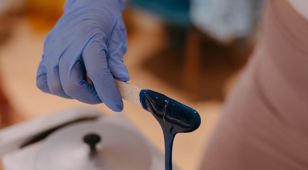 Blue wax application at Dewdrop Lounge, Mission, British Columbia, CA, showcasing professional beauty service.