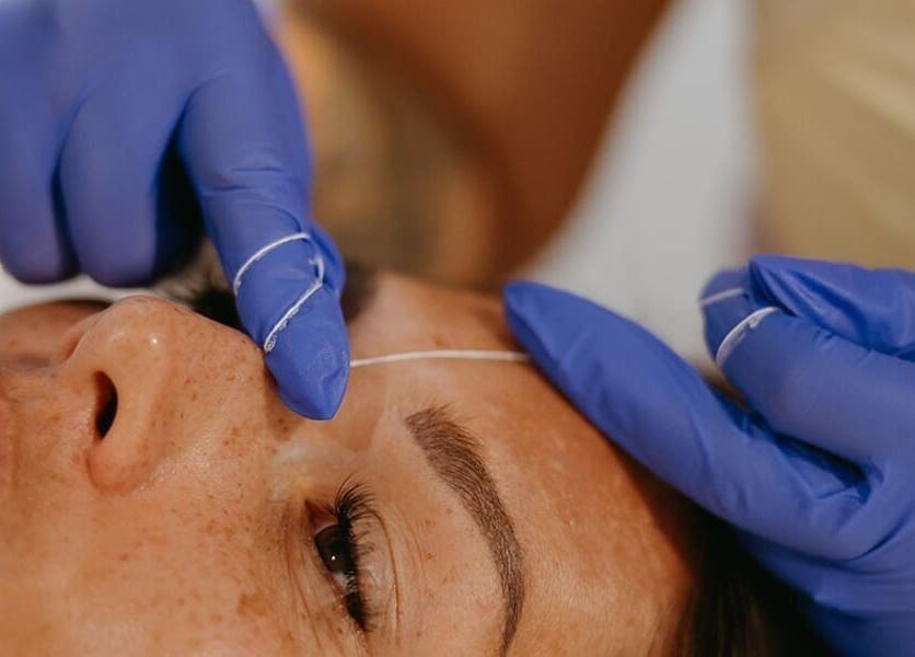 Eyebrow threading at Dewdrop Lounge in Mission, British Columbia, CA. Expert hands ensure precise beauty.