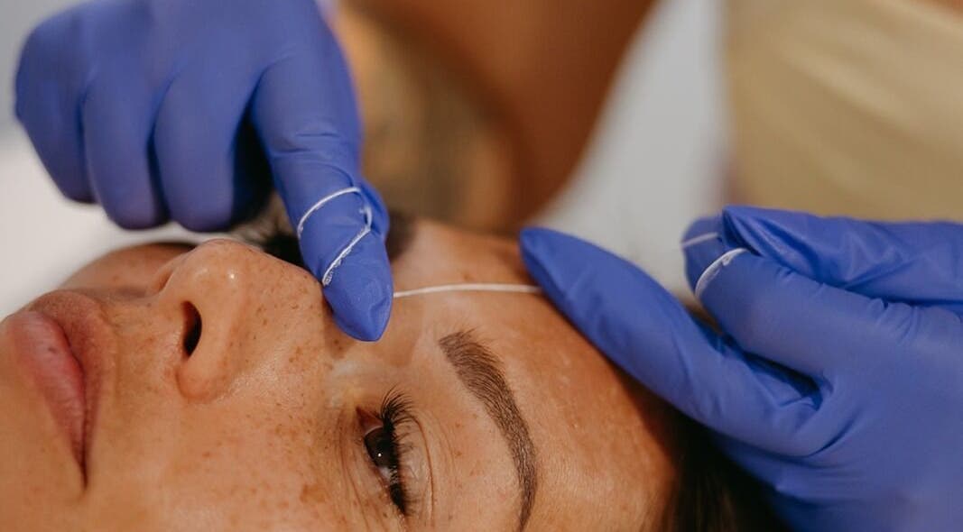 Eyebrow threading at Dewdrop Lounge in Mission, British Columbia, CA. Expert hands ensure precise beauty.