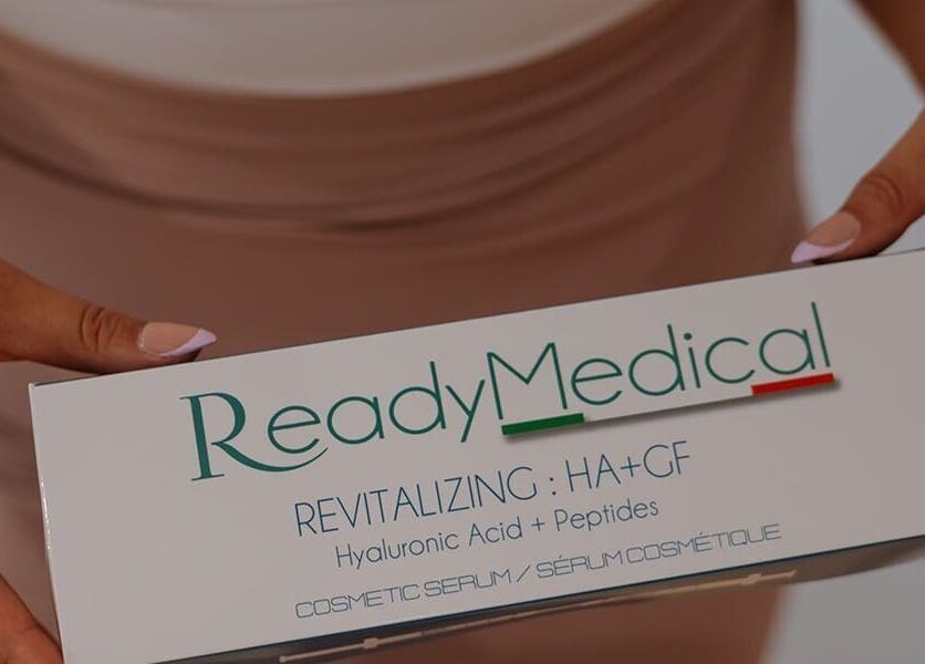 Close-up of ReadyMedical serum box at Dewdrop Lounge, Mission, British Columbia, CA, held by manicured hands.