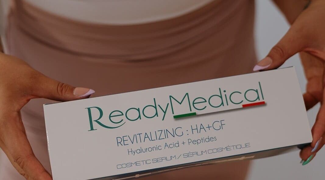 Close-up of ReadyMedical serum box at Dewdrop Lounge, Mission, British Columbia, CA, held by manicured hands.