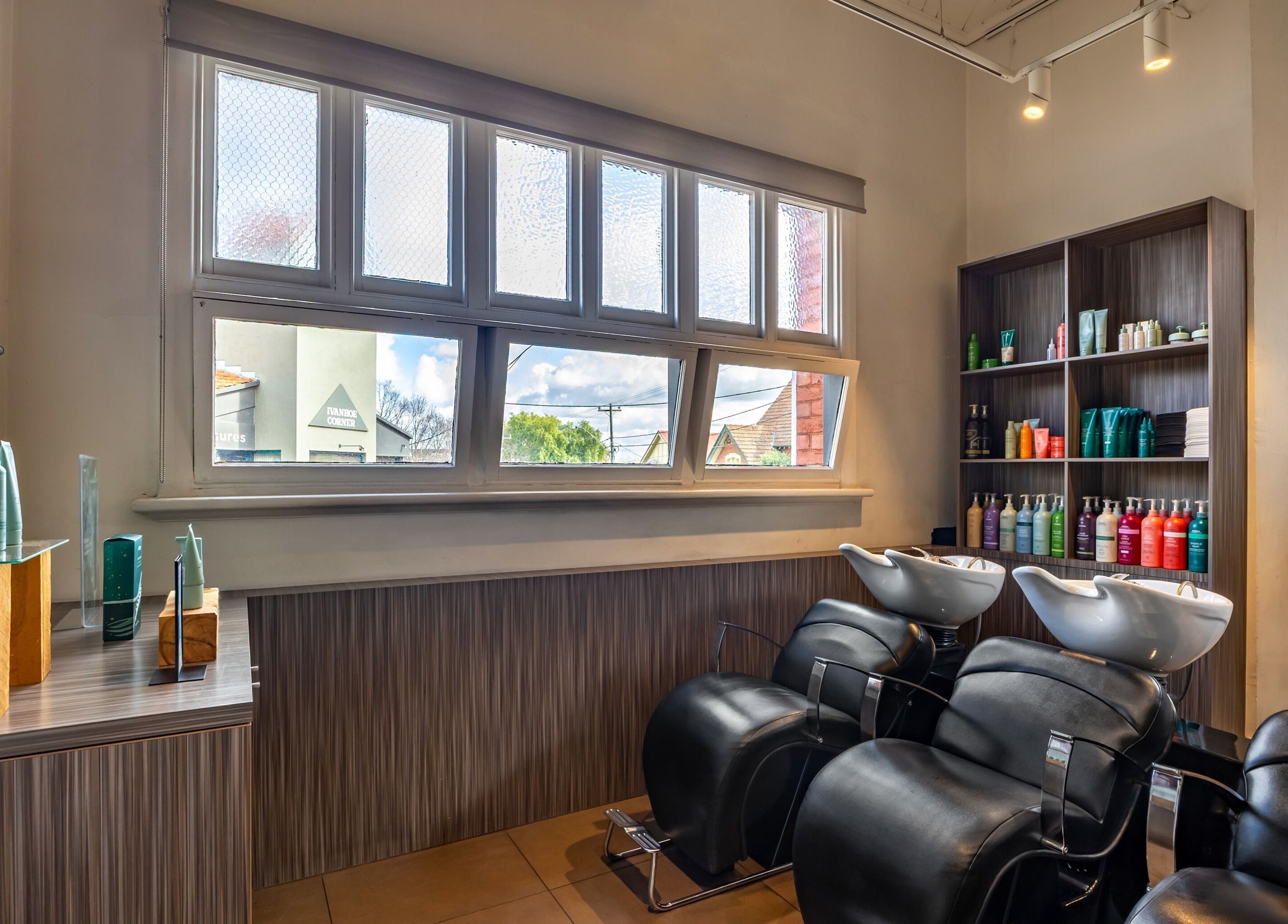Comfortable salon area at Zucci Ivanhoe with sleek wash stations, Melbourne, Victoria, AU.