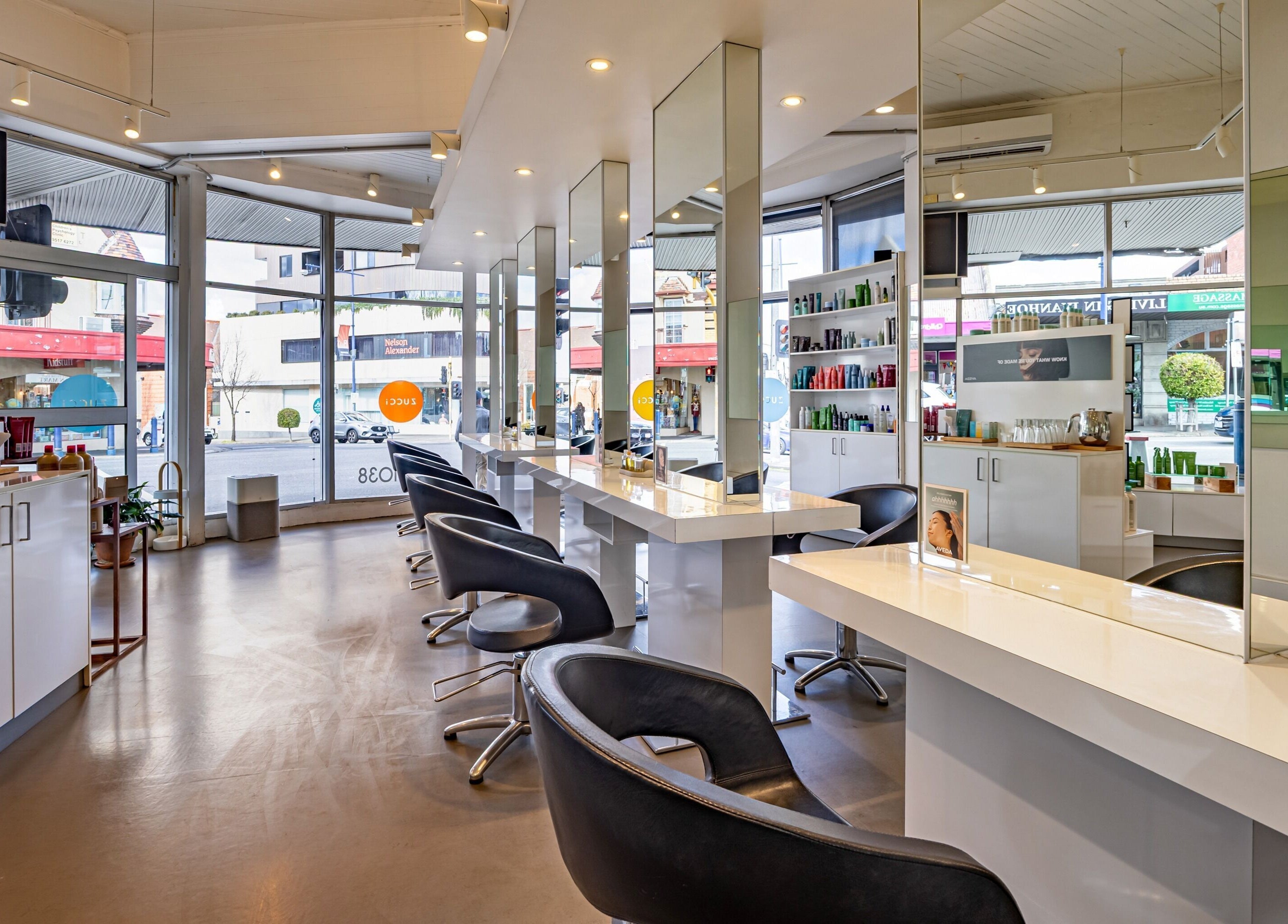 Inside Zucci Ivanhoe salon, bright modern interior with styling chairs in Melbourne, Victoria, AU.
