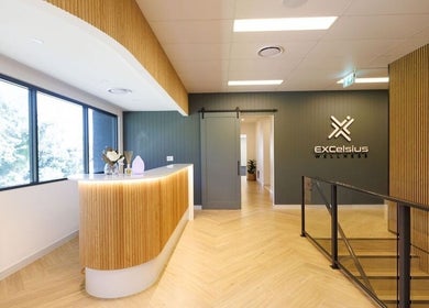Welcoming lobby at Excelsius Wellness Classes, Forest Glen, Queensland, AU with elegant wooden accents.