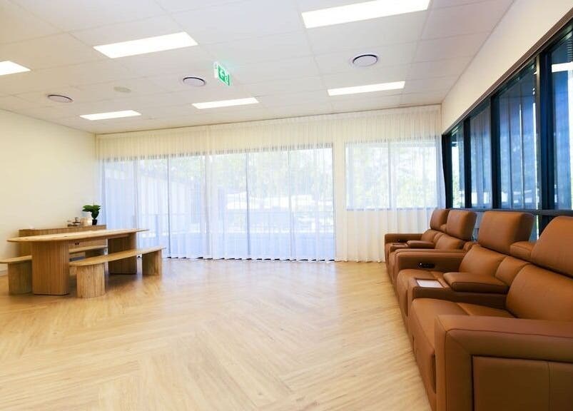 Spacious seating area at Excelsius Wellness Classes, Forest Glen, Queensland, AU, featuring plush leather couches.