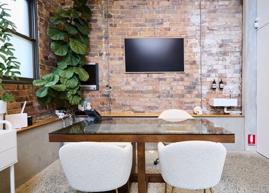Cozy and stylish consultation room at Nurse Amy Aesthetics, Paddington, New South Wales, AU with indoor plants.