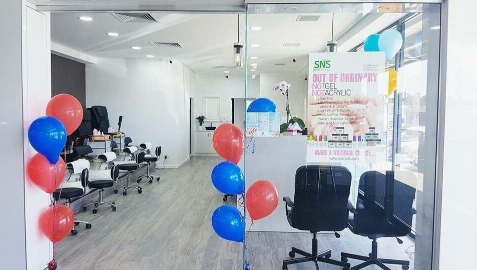 Stylish entrance of P&H Crystal Nails and Beauty in Bertram, Western Australia, AU with colorful balloons.