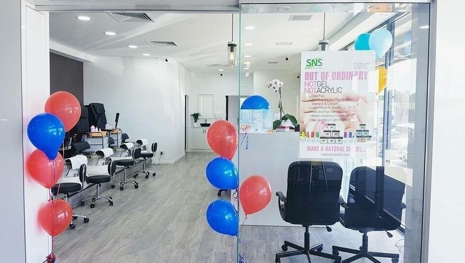 Stylish entrance of P&H Crystal Nails and Beauty in Bertram, Western Australia, AU with colorful balloons.