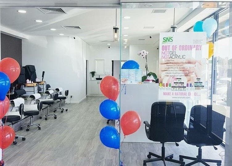 Stylish entrance of P&H Crystal Nails and Beauty in Bertram, Western Australia, AU with colorful balloons.