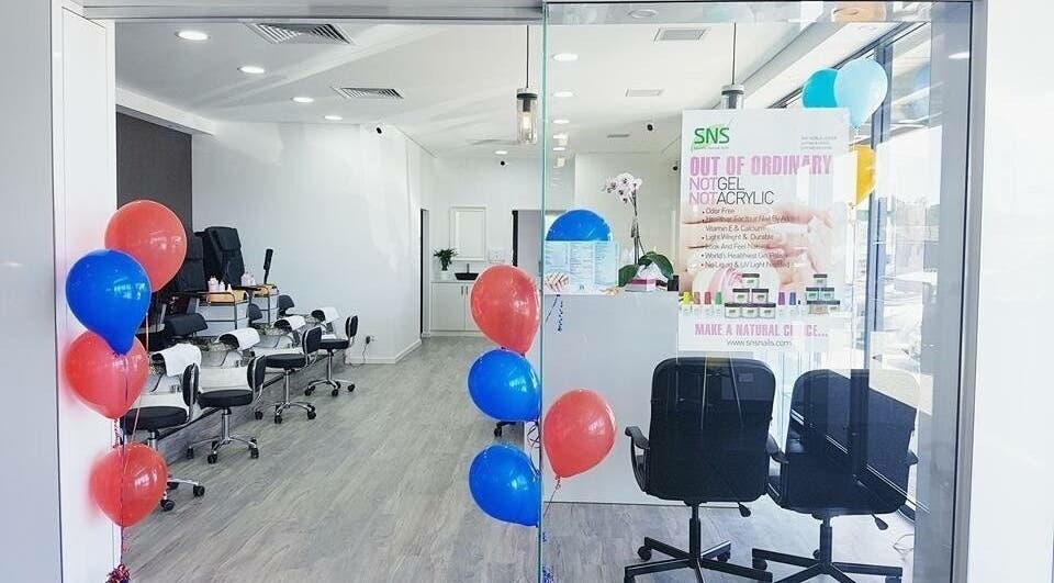 Stylish entrance of P&H Crystal Nails and Beauty in Bertram, Western Australia, AU with colorful balloons.