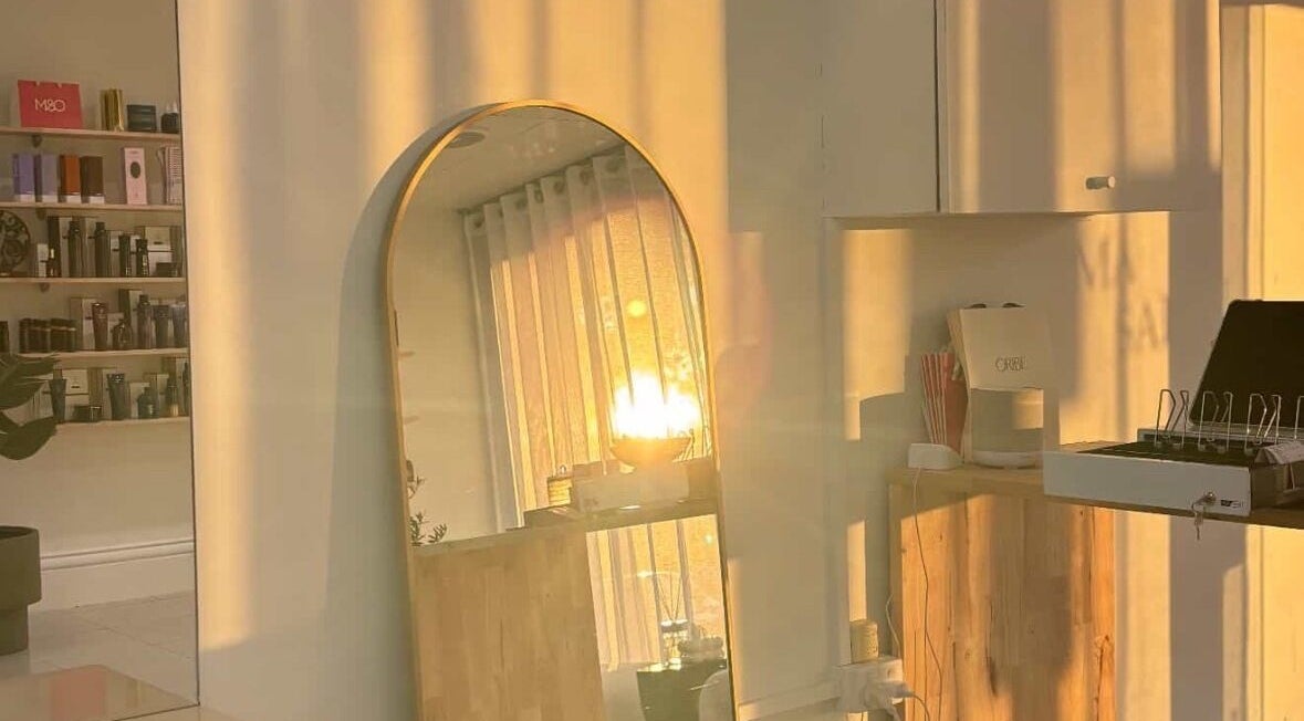 Warm sunset lighting at Hair by Chloe Shaye, Diamond Creek, Victoria, AU, enhancing salon's serene ambiance.