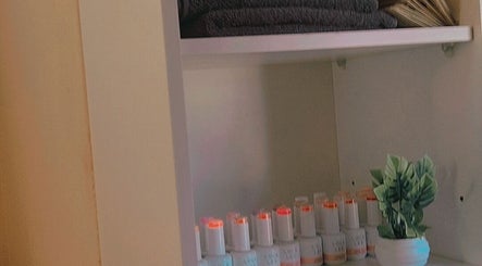 Tidy shelf with towels and beauty products at Bontlebotse Beauty, Boksburg, Gauteng, ZA.