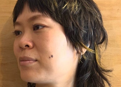 Stylish layered haircut with highlights at Onics Hair, London, England, GB.