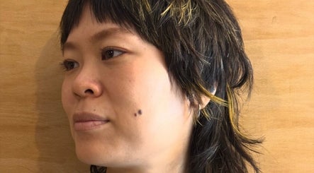 Stylish layered haircut with highlights at Onics Hair, London, England, GB.