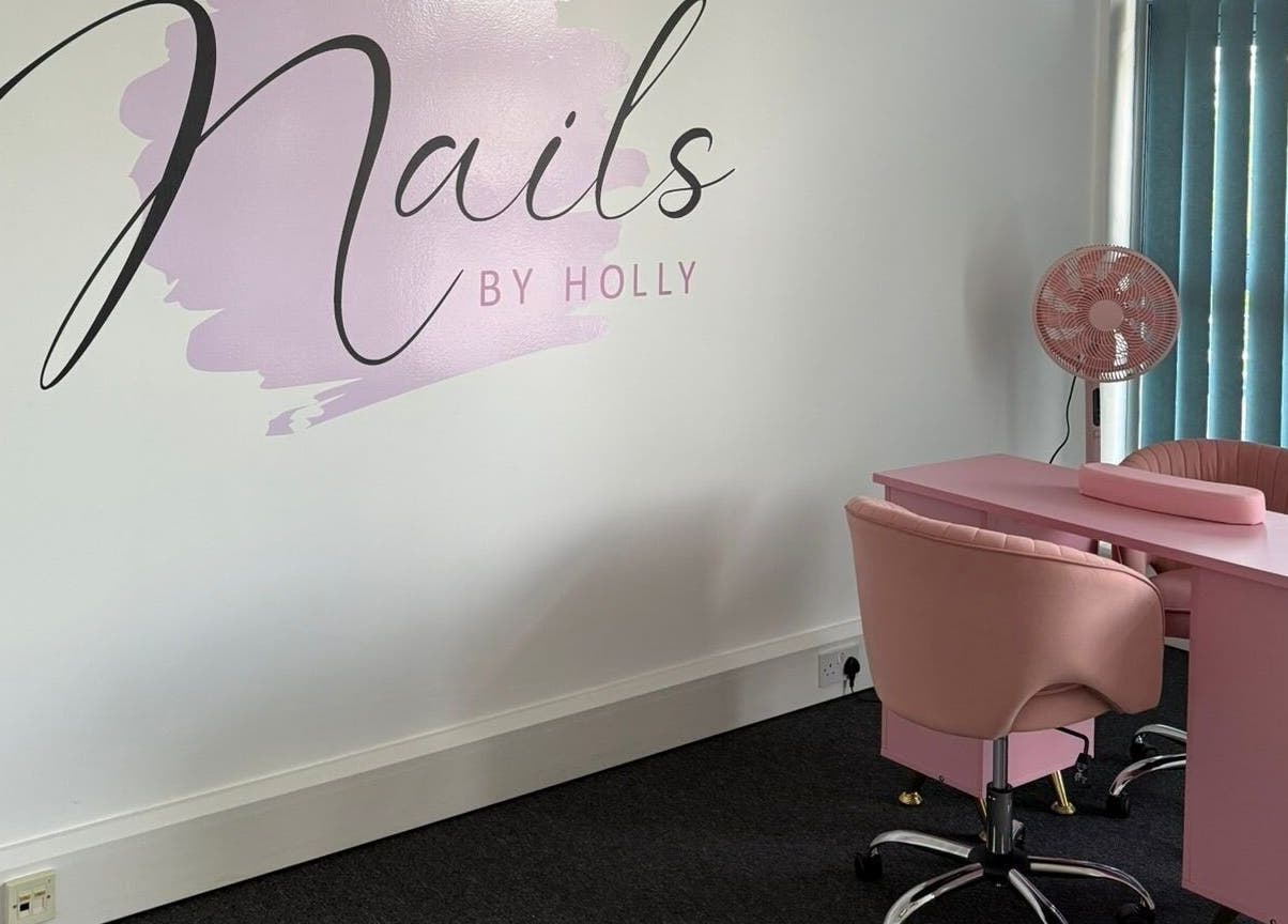 Elegant nail studio at Nails By Holly, Great Blakenham, England, with pink decor and modern furnishings.