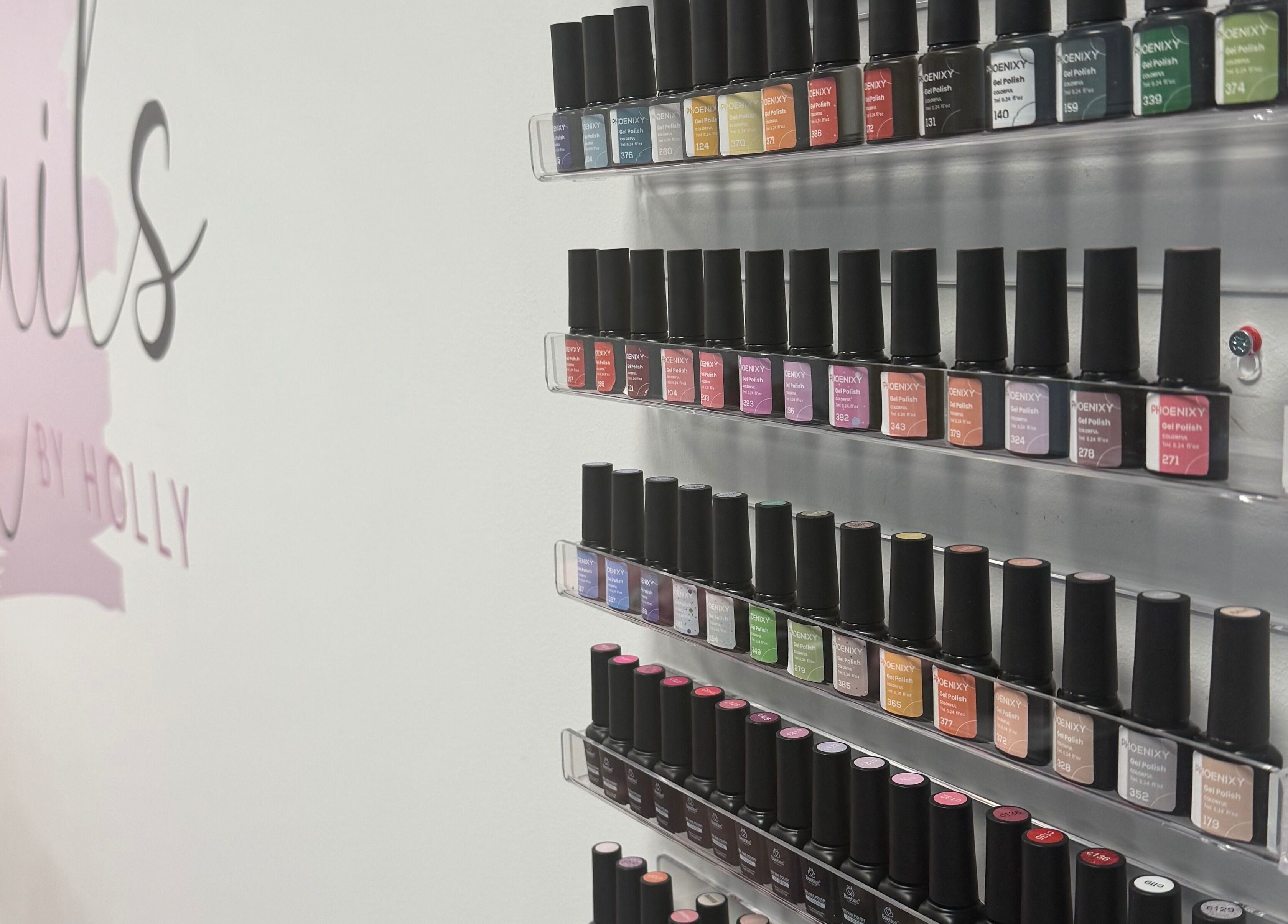 Nail polish collection at Nails By Holly, Great Blakenham, England, GB. Vibrant colors on display.