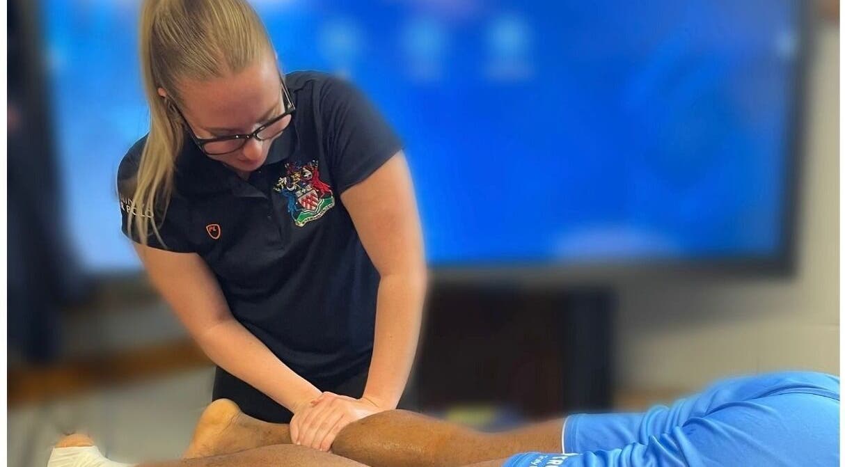 Therapist at Sledge Sport Therapy in Bristol, England, GB, providing leg massage.