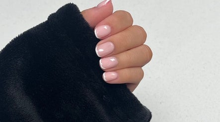 Glossed by Ell French manicure in Oldbury, England, GB showcasing elegant and glossy nails.