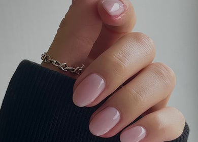 Glossed by Ell in Oldbury, England, showcases elegant manicured nails with a soft pink polish.