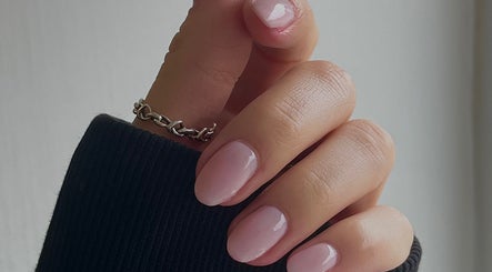 Glossed by Ell in Oldbury, England, showcases elegant manicured nails with a soft pink polish.