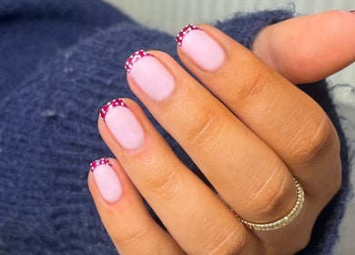 Stylish dotted French manicure at Glossed by Ell, Oldbury, England, GB showcasing elegant nail art design.