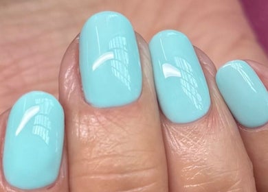 Freshly manicured nails with aqua polish at Cured By Jess, Sandbach, England, GB.