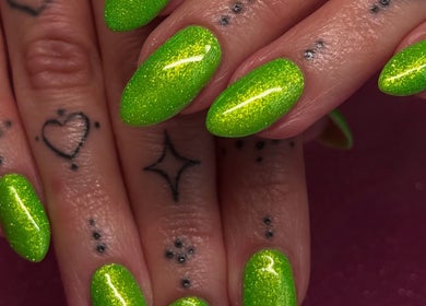 Vibrant neon green nails with delicate tattoos at Cured By Jess, Sandbach, England, GB.