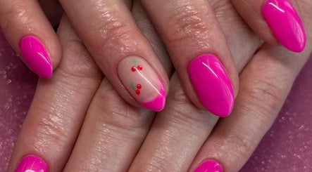 Vibrant pink manicure with cherry design at Cured By Jess, Sandbach, England, GB.