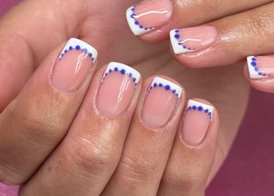 Nail art with blue dots at Cured By Jess in Sandbach, England, GB. Elegant manicure with unique design.
