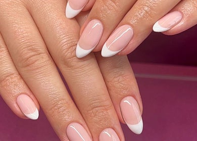 Elegant French manicure with pink base at Cured By Jess, Sandbach, England, GB. Perfect for a classy look.
