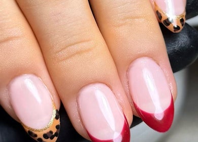 Elegant nail art with red and leopard tips at Cured By Jess, Sandbach, England, GB.