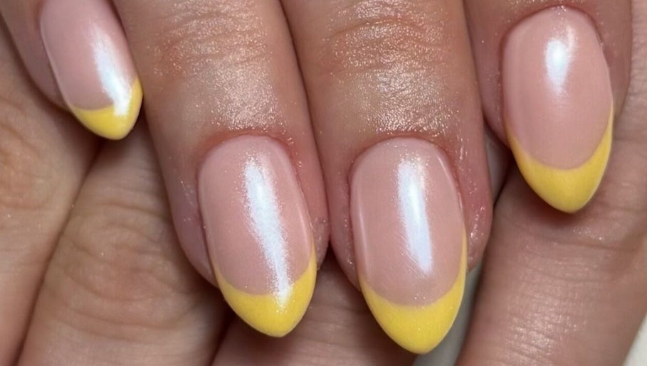 Fresh yellow French manicure at Cured By Jess, Sandbach, England, GB, showcasing elegant nail art.