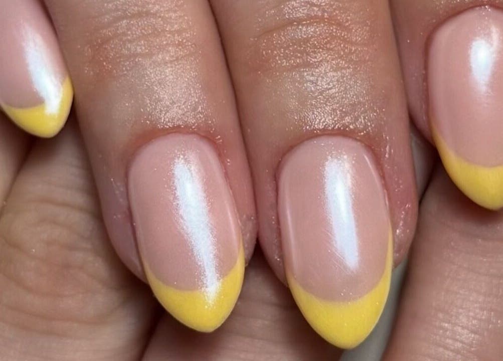 Yellow-tipped manicured nails at Cured By Jess, Sandbach, England, GB.