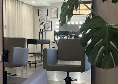 Modern makeup studio at Zee’s Makeup Artistry, Melbourne, Victoria, AU, featuring sleek styling chairs and decor.