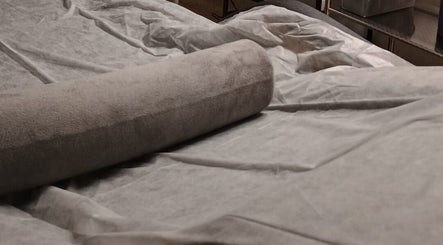 Luxurious spa treatment table at SKIN TONE CLINIC in London, England, GB, prepared for relaxation.