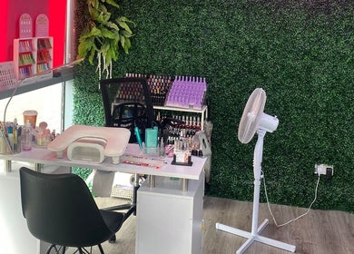 Modern nail station at At Your Fingertips, Tralee, County Kerry, IE, featuring a green wall backdrop.