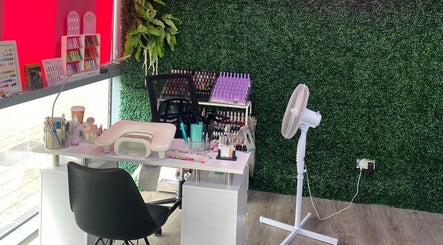 Modern nail station at At Your Fingertips, Tralee, County Kerry, IE, featuring a green wall backdrop.