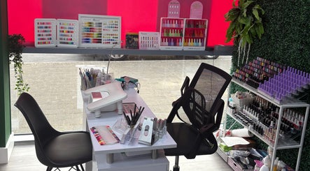 At Your Fingertips nail station with colorful polish in Tralee, County Kerry, IE offering vibrant selections.