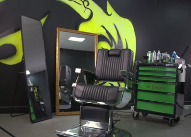 Stylish salon chair and decor at Fortuin Studio, Geelong, Victoria, AU with modern green accents.