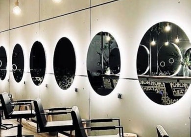 Modern salon mirrors and chairs at Hair By Flute, Southport, Queensland, AU showcasing stylish ambiance.
