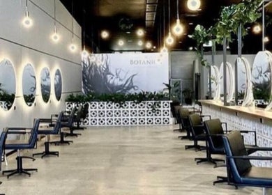 Modern salon interior at Hair By Flute, Southport, Queensland, AU featuring elegant mirrors and stylish chairs.