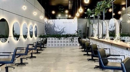 Modern salon interior at Hair By Flute, Southport, Queensland, AU featuring elegant mirrors and stylish chairs.
