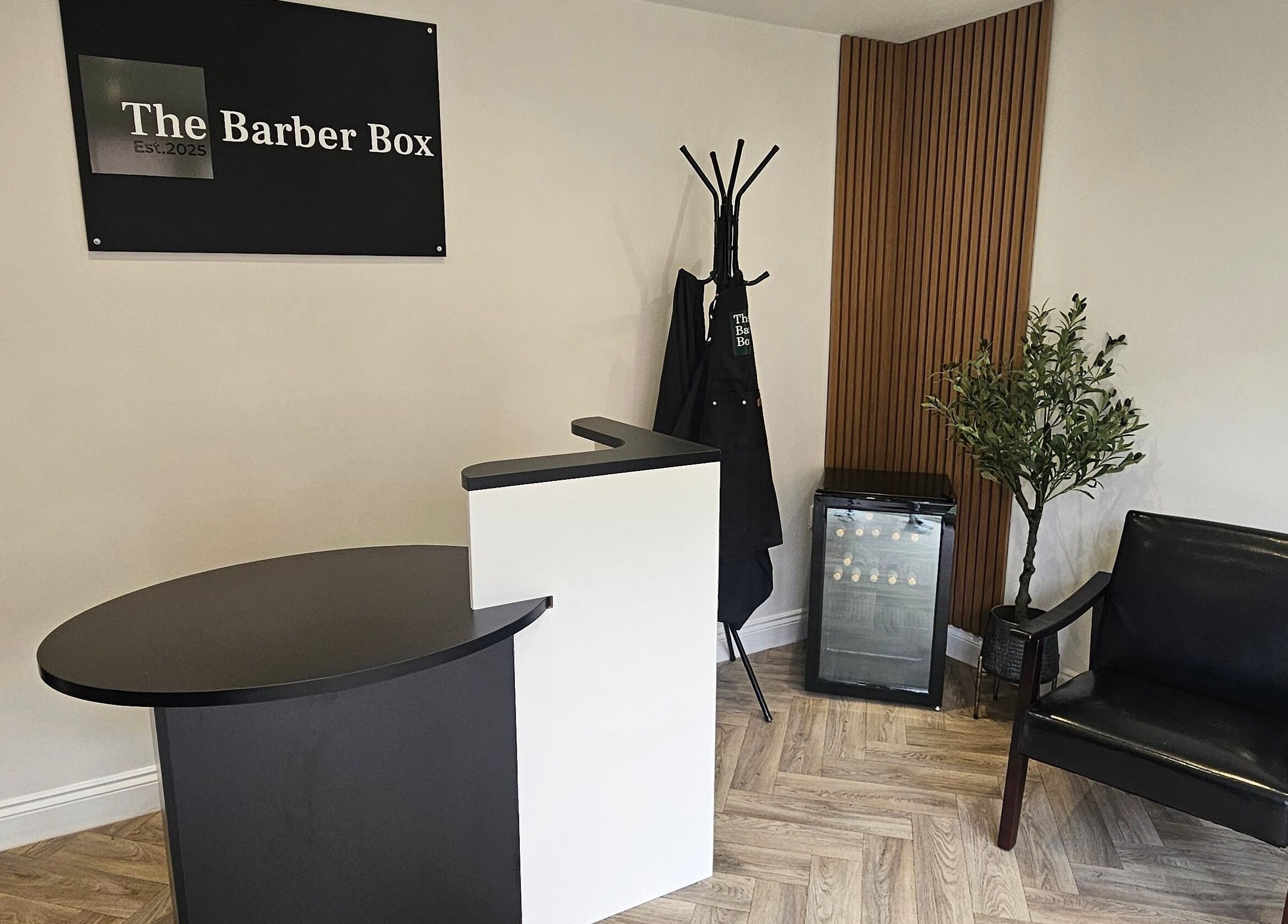 Stylish reception at The Barber Box, Sheffield, England, GB. Minimalist design with seating and decor.