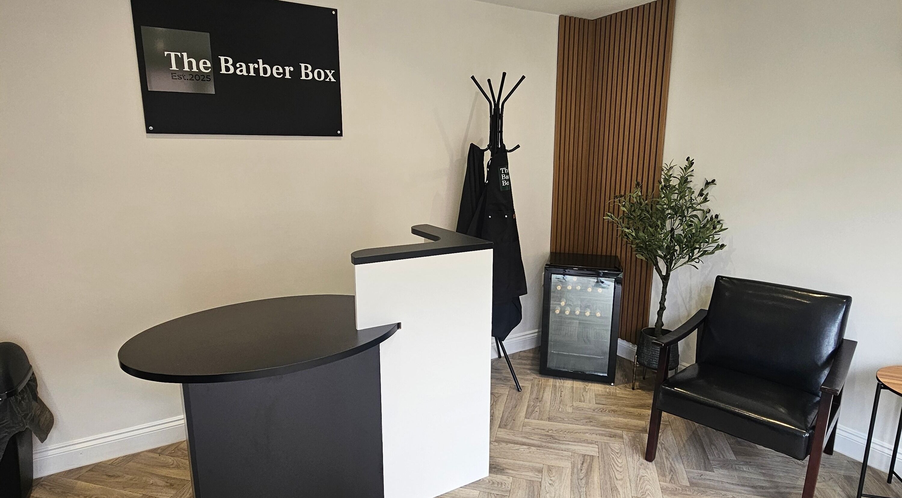 Stylish reception at The Barber Box, Sheffield, England, GB. Minimalist design with seating and decor.
