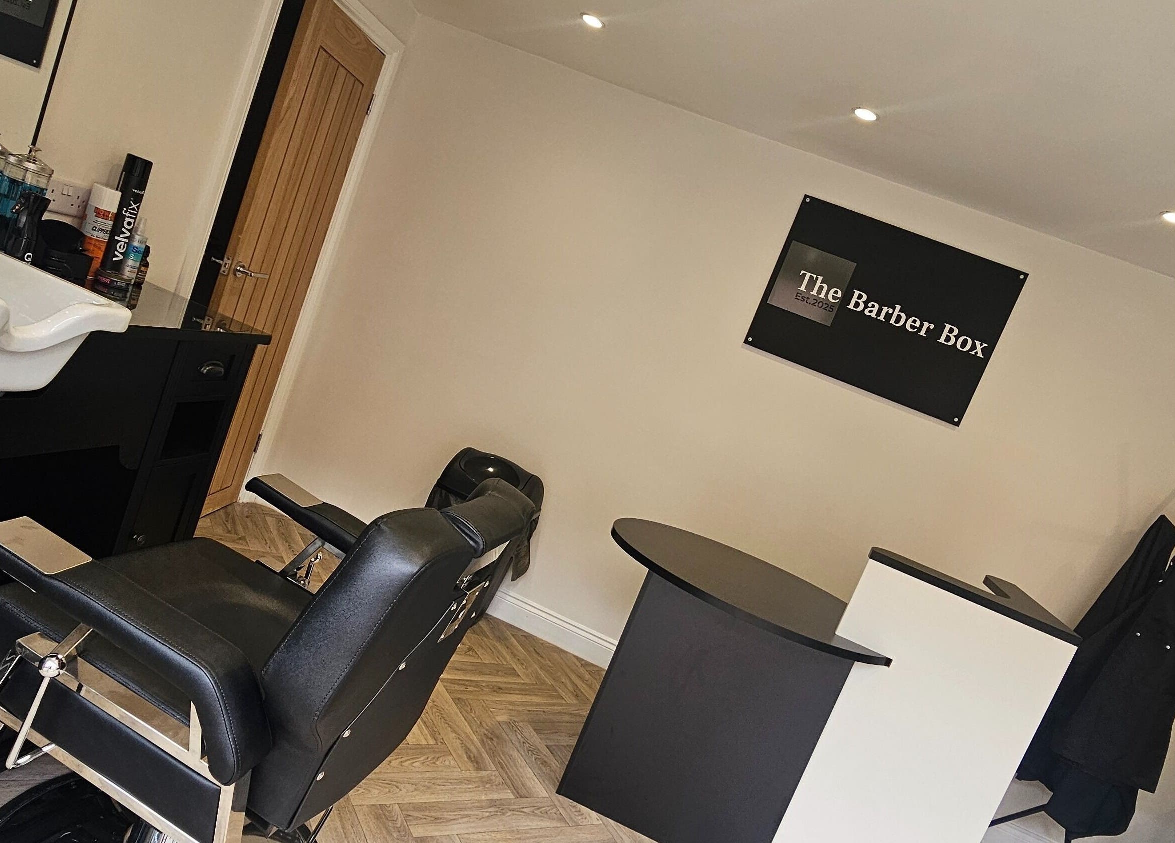 Modern interior of The Barber Box in Sheffield, England, GB showcasing a sleek barber chair and stylish decor.
